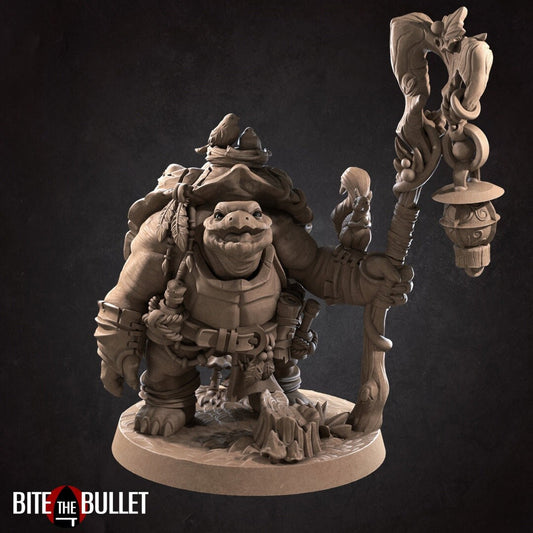 Anthropomorphic tortoise holding a staff, a squirrel perched on his arm. Resin miniature by Bite the Bullet.