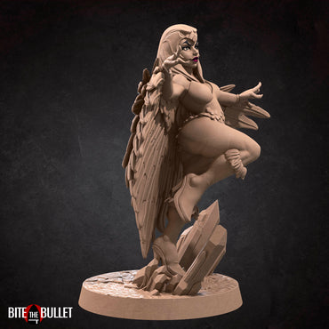 Marina the sorceress wearing a feathered cloak and owl headdress; resin miniature by Bite the Bullet.