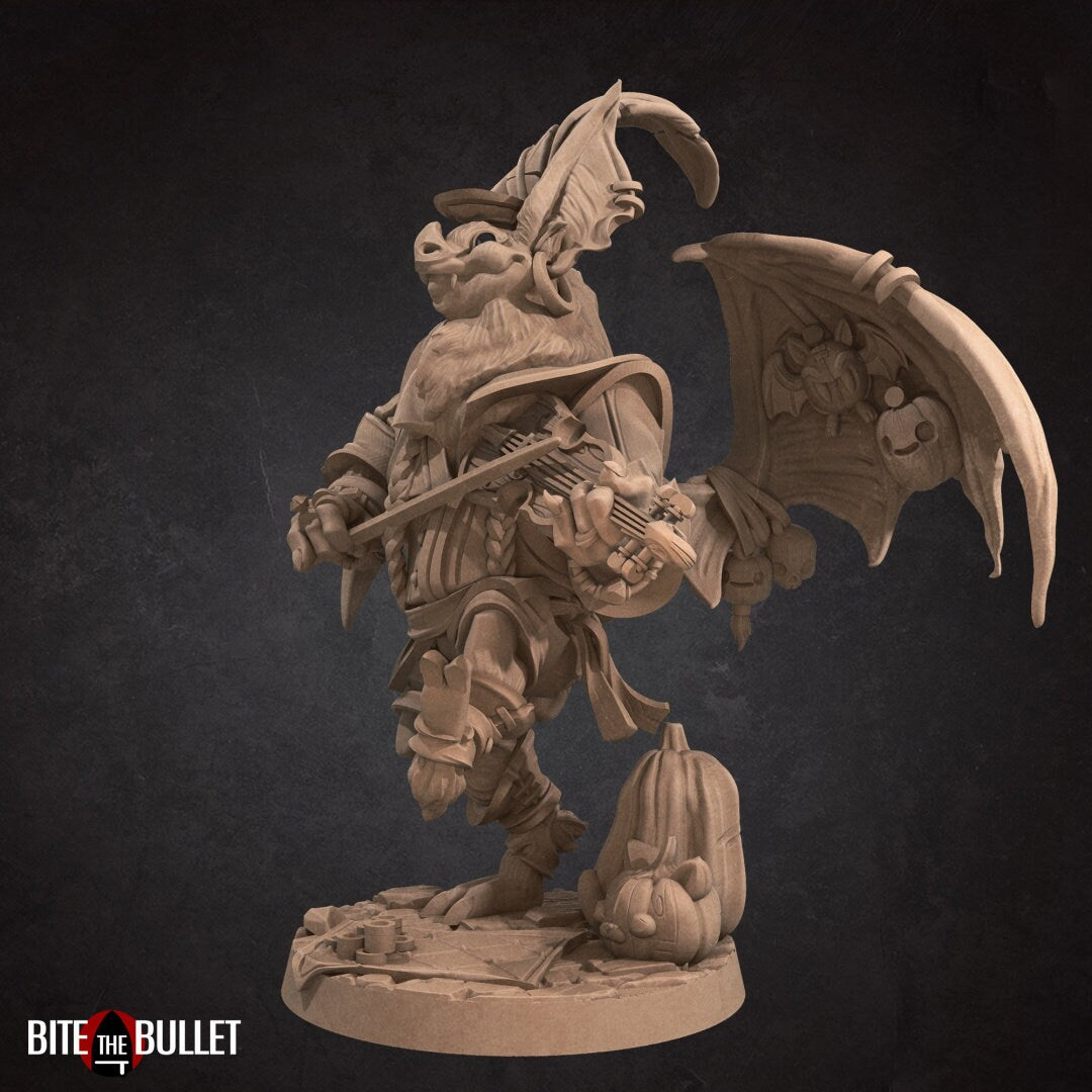 Anthropomorphic bat playing a fiddle, wings spread to display puppets hanging from them. Resin miniature by Bite the Bullet.