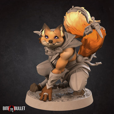 Anthropomorphic red fox rogue holding a curved dagger; resin miniature by Bite the Bullet.