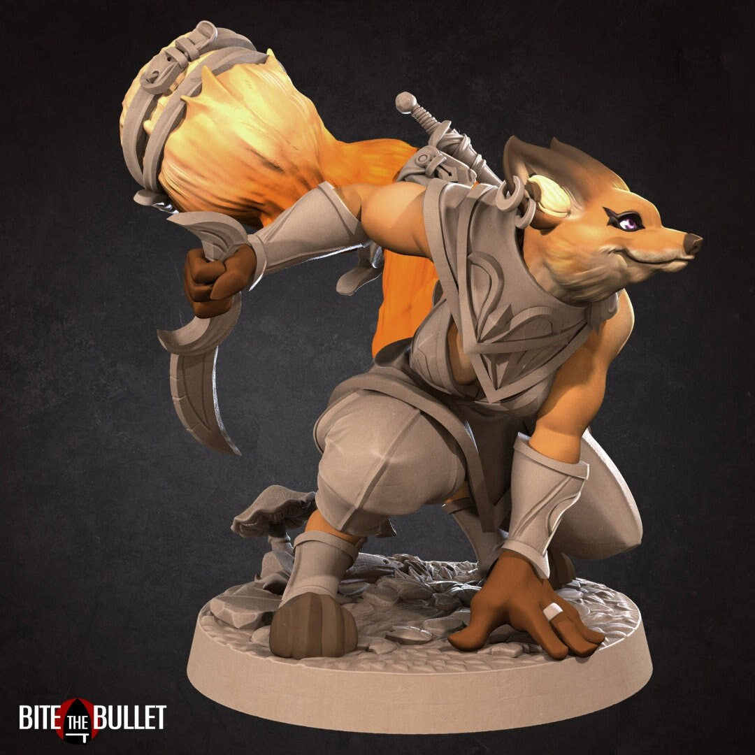 Anthropomorphic red fox rogue holding a curved dagger; resin miniature by Bite the Bullet.