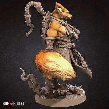 Anthropomorphic red fox monk holding a staff; resin miniature by Bite the Bullet.