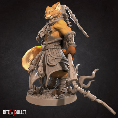Anthropomorphic red fox monk holding a staff; resin miniature by Bite the Bullet.