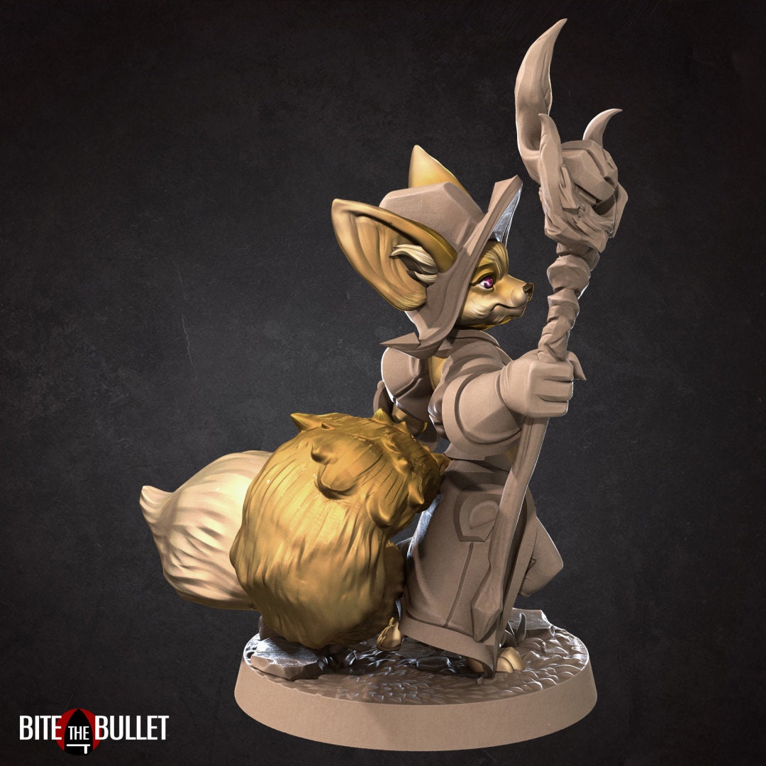 Anthropomorphic fennec fox wizard holding a staff; resin miniature by Bite the Bullet.