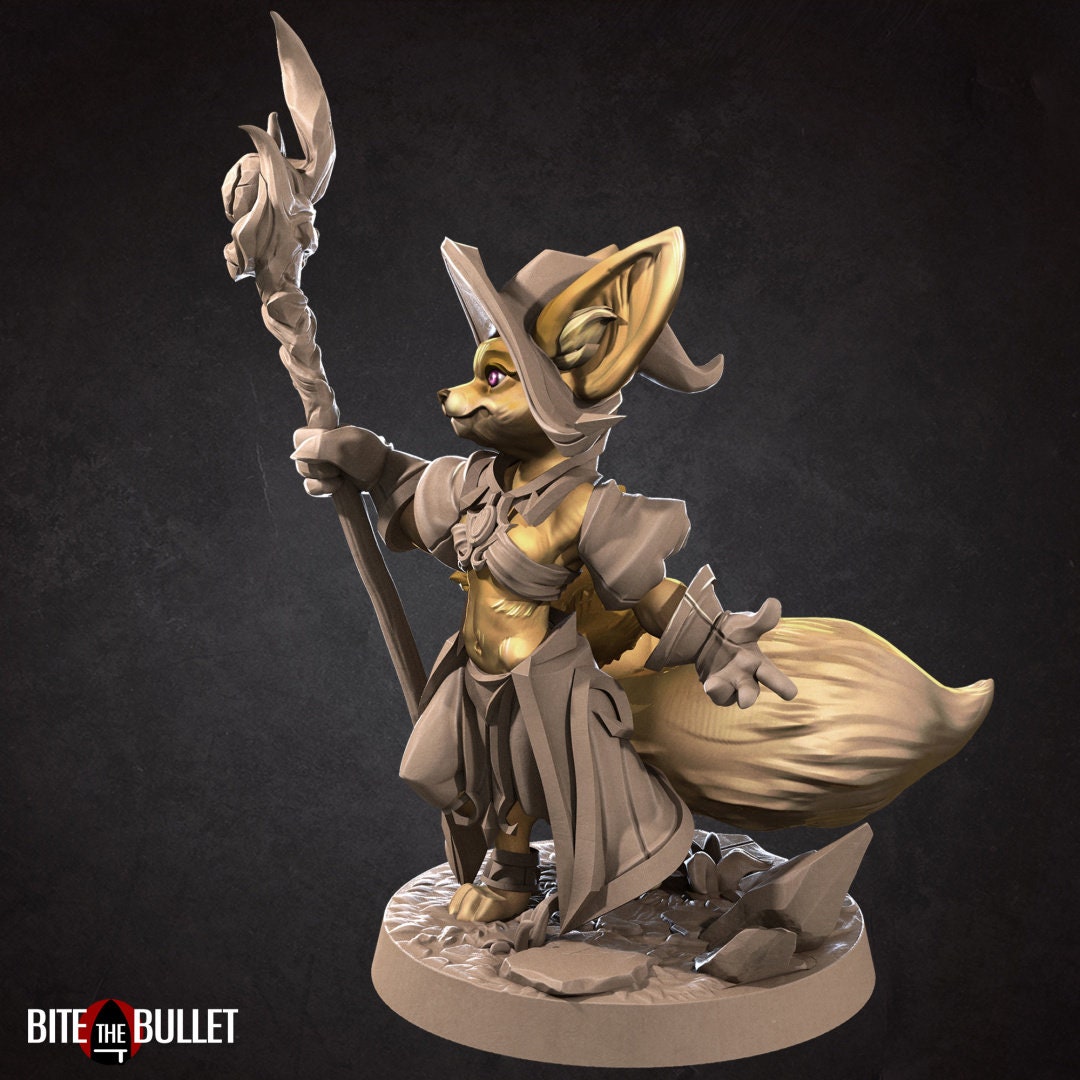 Anthropomorphic fennec fox wizard holding a staff; resin miniature by Bite the Bullet.
