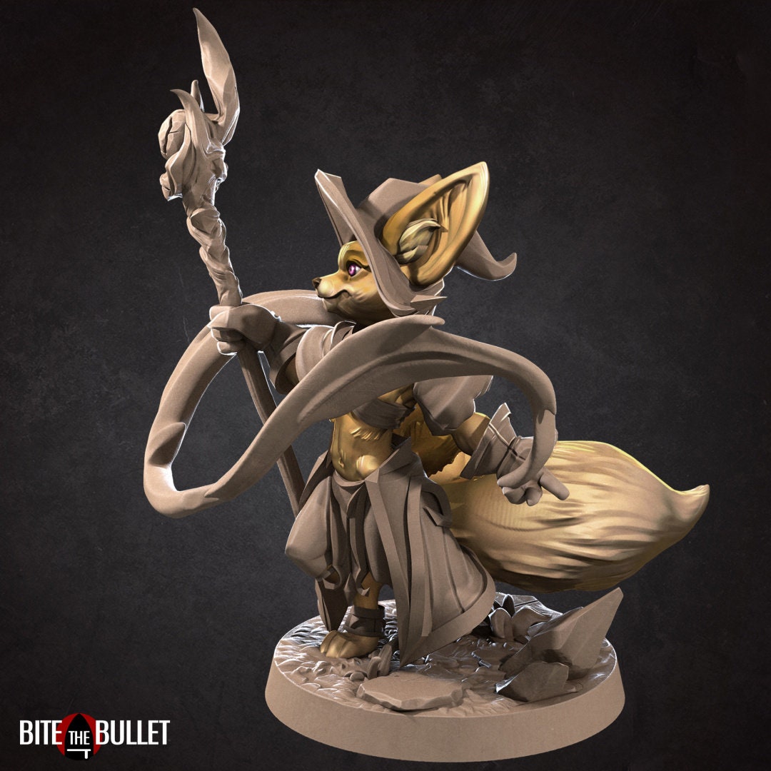 Anthropomorphic fennec fox wizard holding a staff; resin miniature by Bite the Bullet.