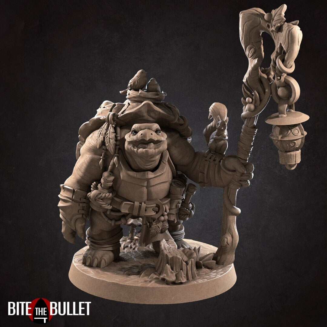 Anthropomorphic tortoise holding a staff, a squirrel perched on his arm. Resin miniature by Bite the Bullet.