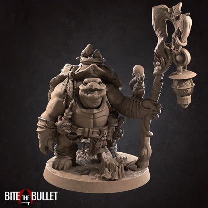 Anthropomorphic tortoise holding a staff, a squirrel perched on his arm. Resin miniature by Bite the Bullet.