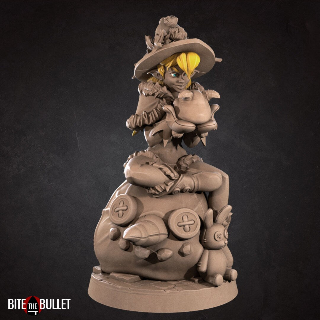 Christmas elf girl with a bare midriff sitting on a toy snowman head, holding a toy that's sticking its tongue out at her. Resin miniature by Bite the Bullet.