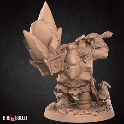 Anthropomorphic turtle barbarian with a huge rock axe on his shoulder, looking kindly at a bird perched on his finger. Resin miniature by Bite the Bullet.