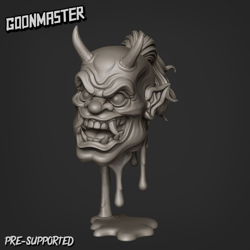 Resin miniature by Goon Master. Oni head with horns and open mouth with tusks, supported by blood dripping into a puddle.