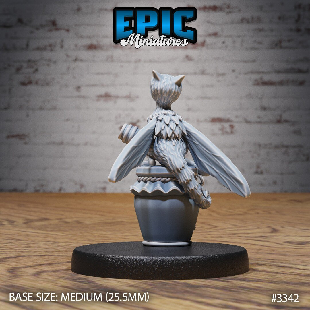 Resin Bee-Dragon Wyrmling miniature by Epic Miniatures. Version #1 rear view: perched on a jar of honey, clutching a honey dipper.