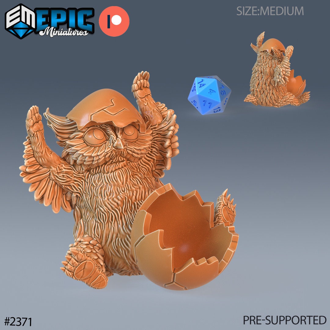 Resin miniatures by Epic Miniatures. Baby owlbear option #1: hatchling with sell on its head like a hat, paws up.