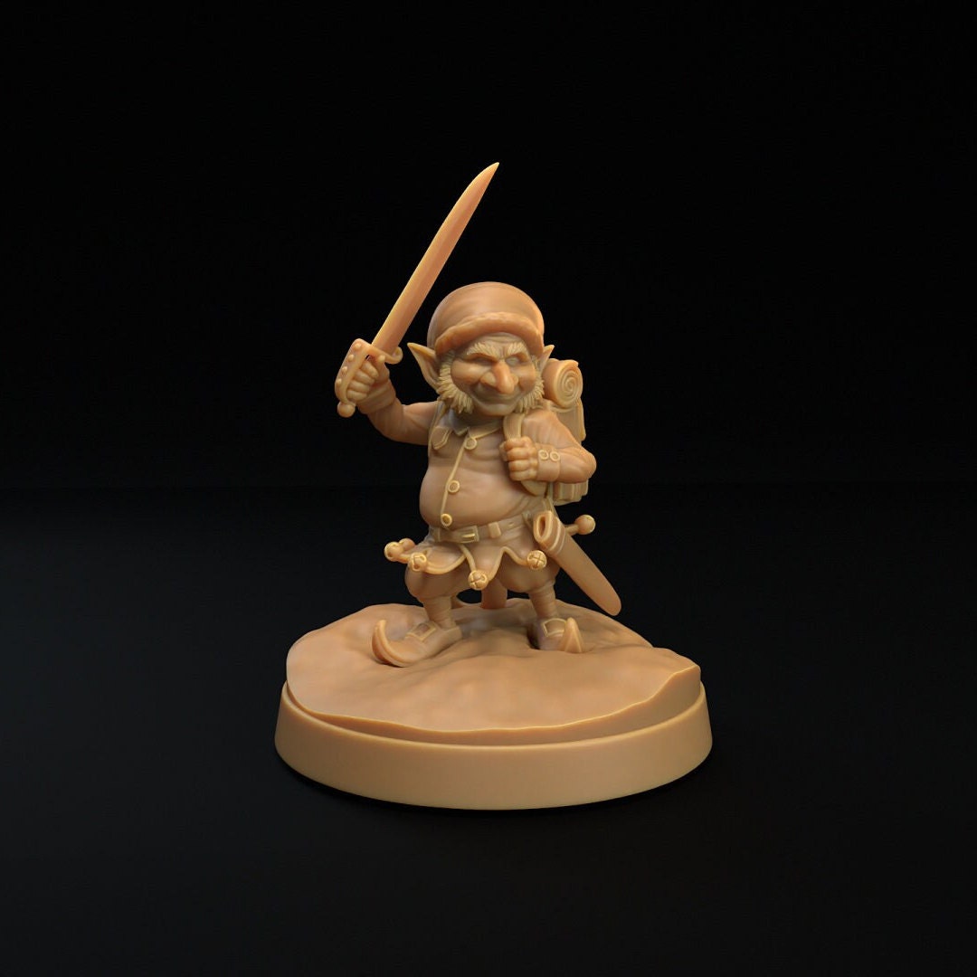 Christmas elf resin miniature by The Dragon Trapper's Lodge. Version #2: wielding a sword, wearing a backpack.