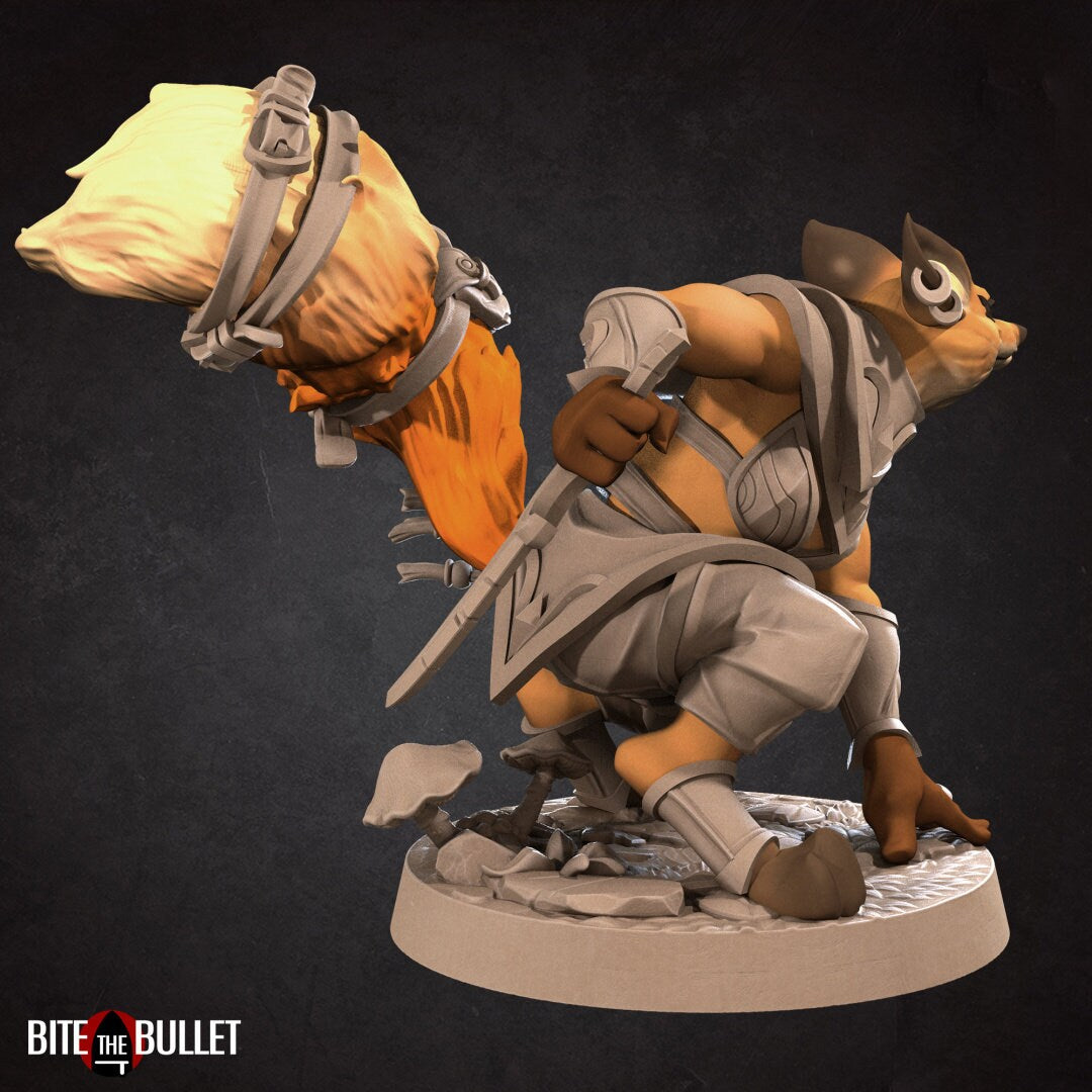 Anthropomorphic red fox rogue holding a curved dagger; resin miniature by Bite the Bullet.