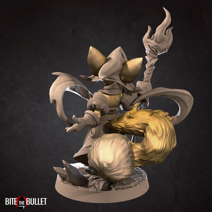 Anthropomorphic fennec fox wizard holding a staff; resin miniature by Bite the Bullet.